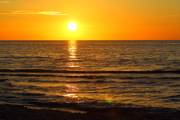 Fototapeta na wymiar sunset at the baltic sea beach of ustronie morskie, poland