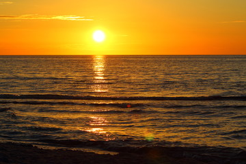 Fototapeta premium sunset at the baltic sea beach of ustronie morskie, poland
