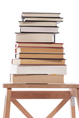Vintage old books on wooden deck stepladder