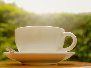 cup of aromatic coffee in the park