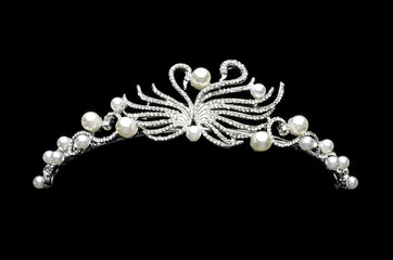silver diadem with swans isolated on black