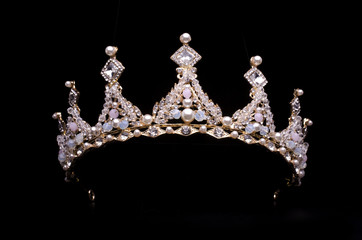 golden crown with pearls and beads isolated on black - obrazy, fototapety, plakaty