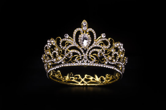 gold crown with diamonds isolated on black
