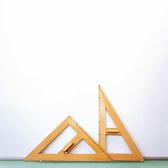TTriangular rulers on blackboard - geometric triangle shapes
