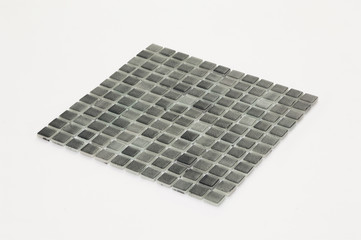 little black ceramic tile on a white background, majolica. for the catalog