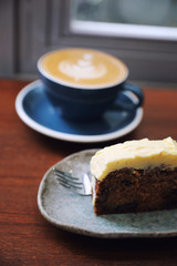 cappuccino or Latte art coffee made from milk on the wood table in coffee shop