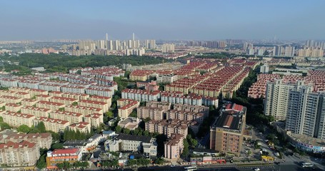 Aerial view on highly populated residential area with blocks of skyscrapers and residential buildings. Shanghai, China.