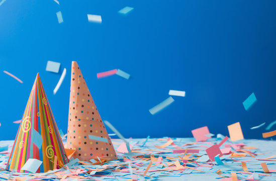 birthday hat and confetti  on blue background
