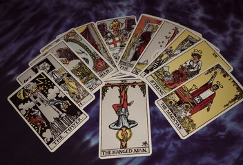 Tarot card spread with hanging man