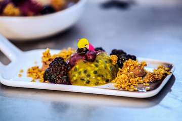 Modern food stylist decorating meal for presentation in restaurant. Closeup of food stylish. Restaurant serving