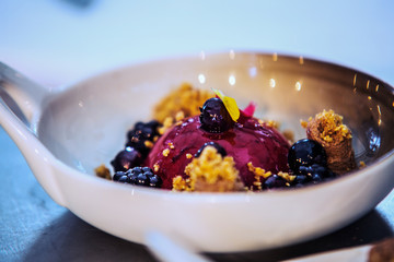 Modern food stylist decorating meal for presentation in restaurant. Closeup of food stylish. Restaurant serving