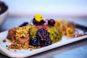 Modern food stylist decorating meal for presentation in restaurant. Closeup of food stylish. Restaurant serving