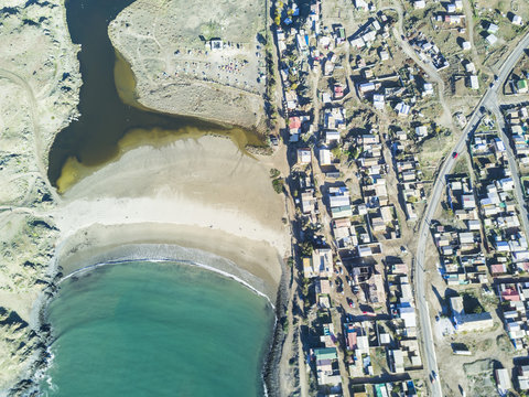 An aerial view of Llanos de Challe National Park, Atacama Desert at the coast area. Amazing landscape like this coastline of the Pacific Ocean at Carrizal Bajo town with it gorges and valleys, Chile