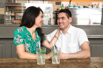 Beautiful brunette woman touches her husband's cheeks