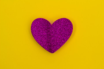 Glitter pink Heart on yellow background
