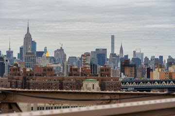 Fototapeta na wymiar View of Midtown Manhattan from Brooklyn Bridge on a Cloudy Day