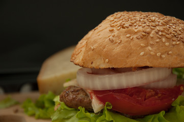 Homemade hamburger with fresh vegetables.