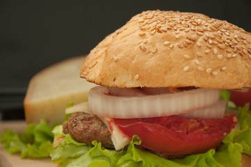 Homemade hamburger with fresh vegetables.