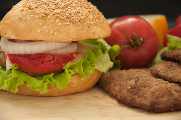 Homemade hamburger with fresh vegetables.