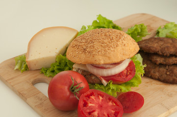 Homemade hamburger with fresh vegetables.