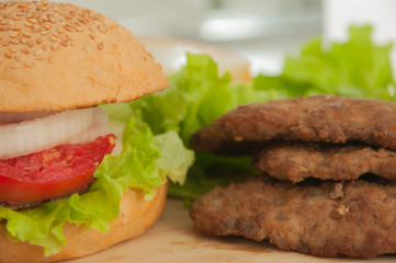 Homemade hamburger with fresh vegetables.