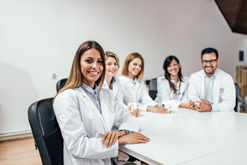 Group of doctors at office. Looking at camera.