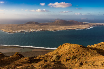 View of La Graciosa Island off Lanzarote coast with foreground and copy space