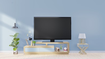 Tv screen in modern empty room and lamp,plants,Decoration on back blue wall background, 3d rendering.