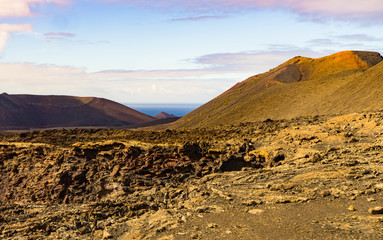 Fototapeta na wymiar Desert landscape of Timanfaya National Park with crater