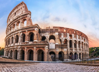 Fototapeta na wymiar Colosseum in Rome at the Sunrise Time - Colosseum is one of the main travel attractions - The Main symbol of Rome