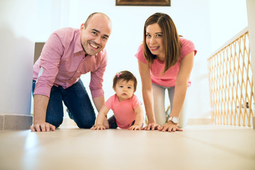 Baby and family crawling on the floor