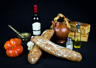 Still life bread, oil, wine and tomato