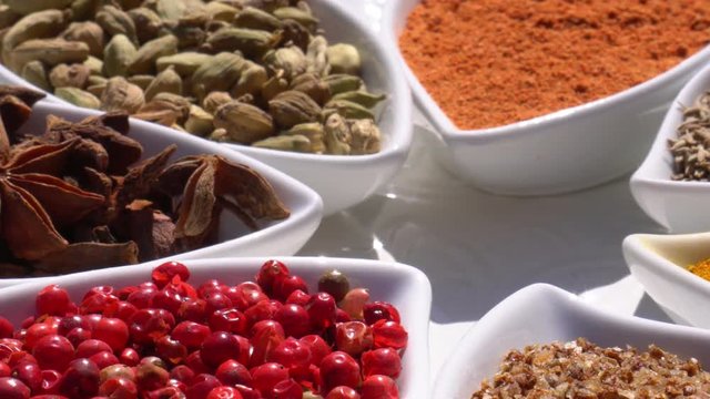 Dry spices on a rotary table. 4K. Macroshooting.
