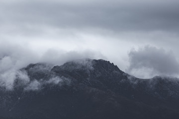 Fototapeta na wymiar Dark Mountains on Cloudy Day