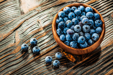 Fresh blueberries in wooden bowl