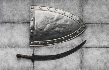 shield and sword isolated on a dark background