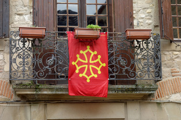 Occitania flag hung on a balcony