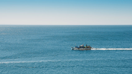 Naklejka premium Fishing boat returning to home harbor, Portugal