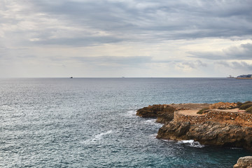 dramatic sea cliff Tarragona Spain