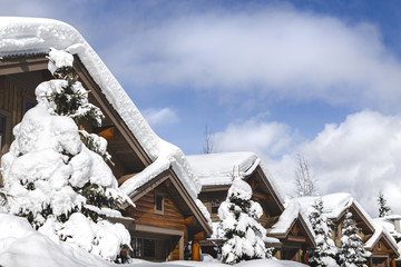 Snow covered rooftops of mountain cabins in Whistler.