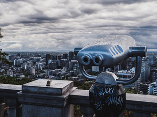 tourist viewpoint with telescope looking to downtown montreal canada