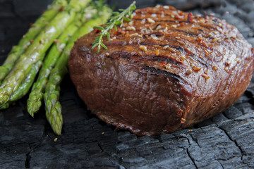 beef steak grilled with asparagus, tomatoes, spice