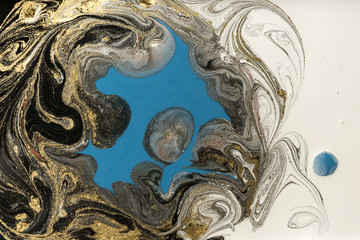 Marble abstract acrylic background. Marbling artwork texture. Agate ripple pattern. Gold powder.