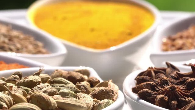 Dry spices on a rotary table. 4K. Macroshooting.