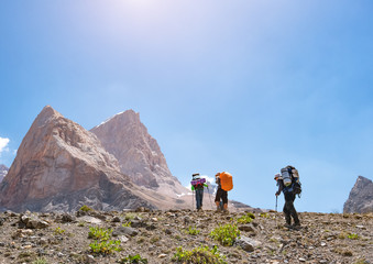 Group of backpackers hiking in Fann mountains. Tajikistan, Central Asia