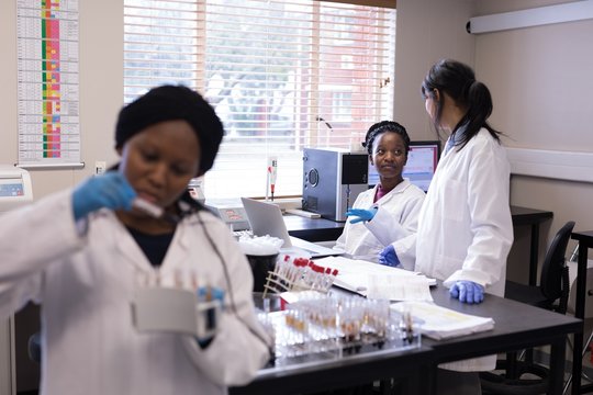 Laboratory technician interacting with each other