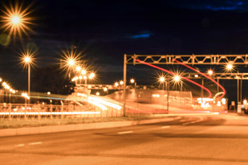 Fototapeta na wymiar Night shooting road. At night the city lights up. Lighting of the motorway.