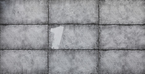 Old conctete blocks wall texture background,gray abstract cement wall with numbers