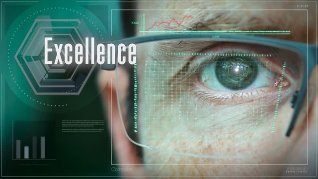 A close up of a businessman eye controlling a futuristic computer system with an Excellence concept.