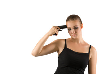 Young beautiful woman holding a gun on white background